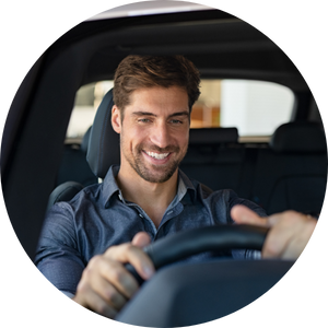 A man enjoys driving his new car
