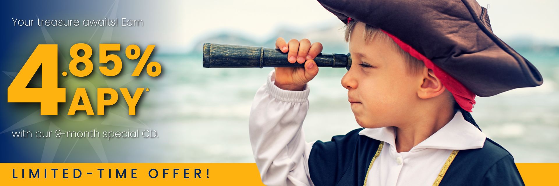 A young boy dressed as a pirate looks through a spyglass.